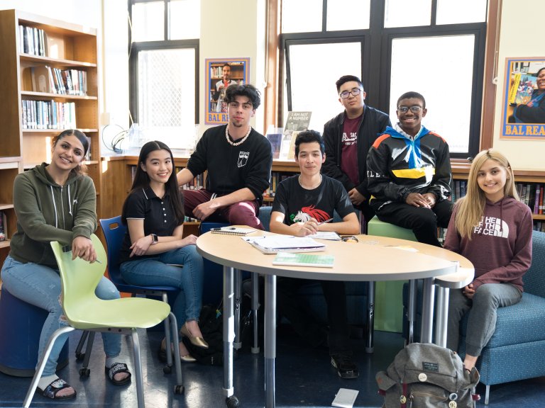 Group of students at a table in the library