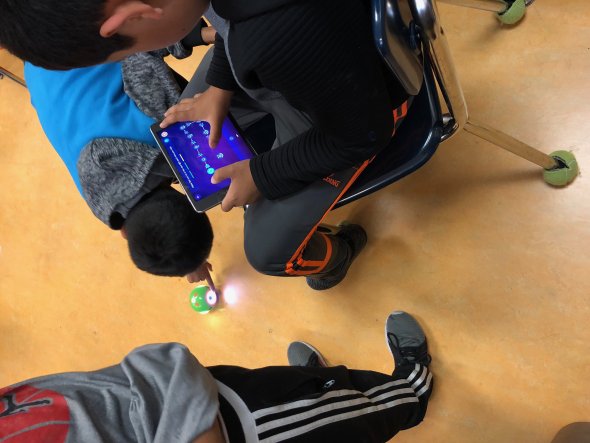 Students programming a robot.
