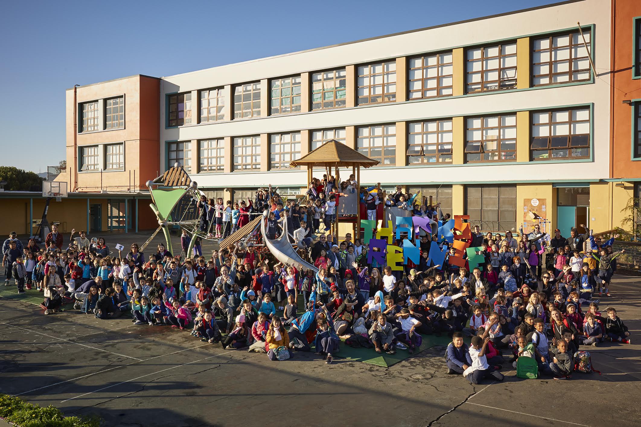 Starr King Elementary students and staff posing for picture to thank parents, Rennie Saunders for championing school_s _greening committee