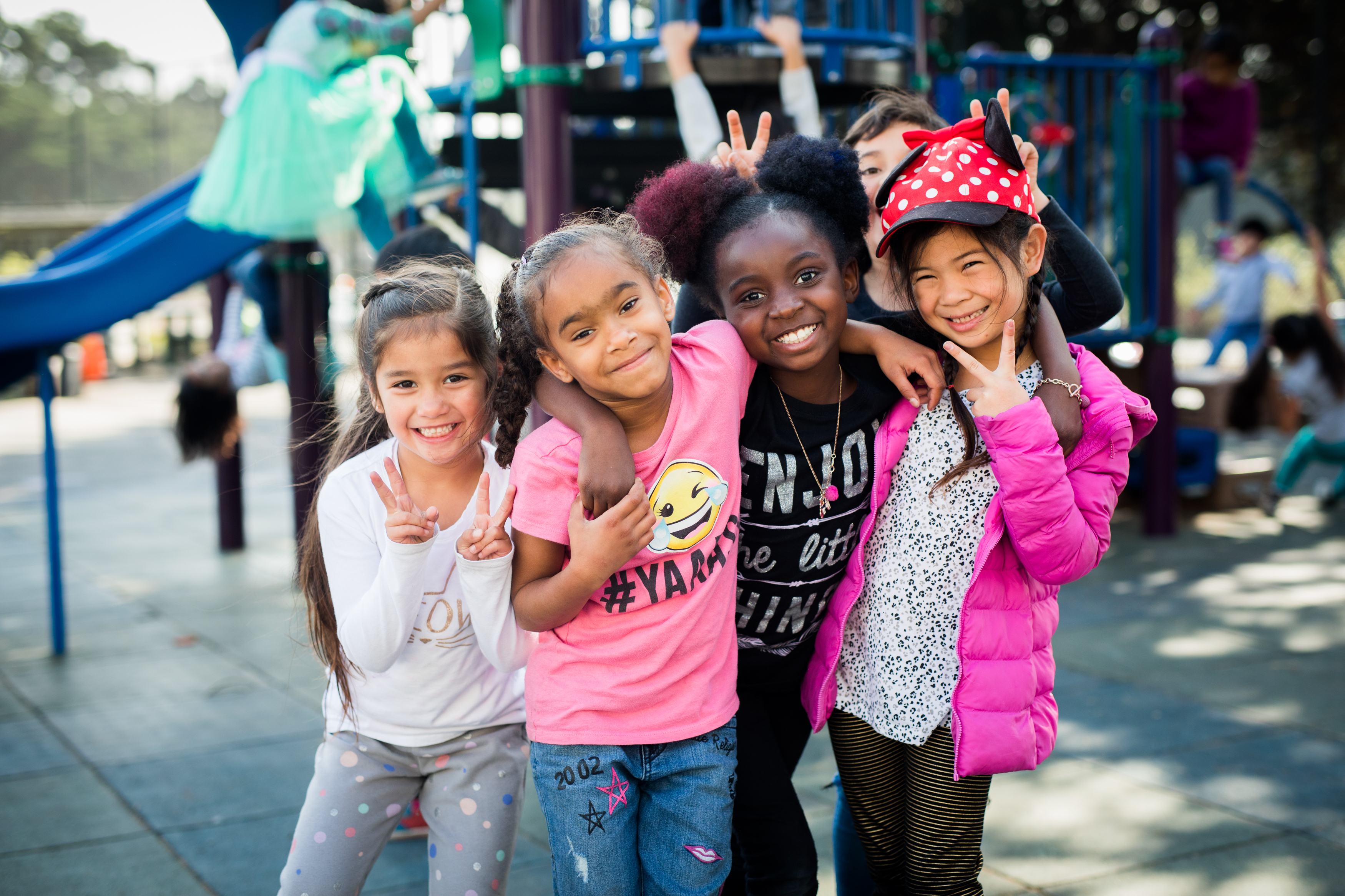 Girls smiling in schoolyard