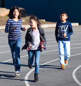 Children running on a track