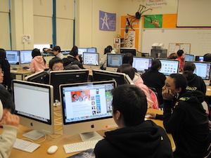 Class of students working on computers