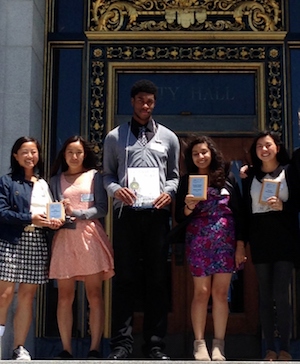 students holding awards