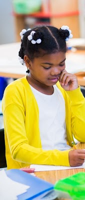 Girl working on her paper