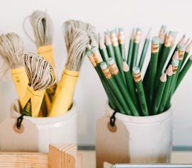 Paintbrushes sorted into two cups