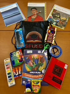 Art supply kit featuring SFUSD tote bag and curriculum materials