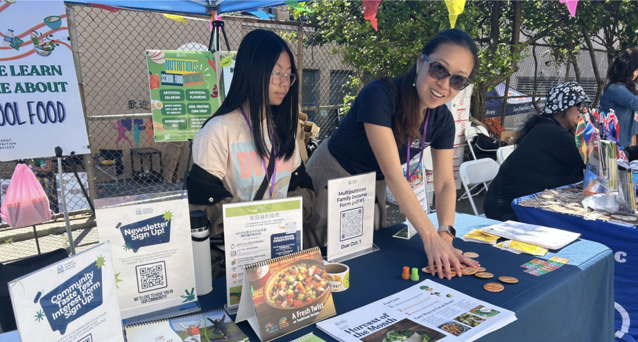 Student Nutrition Services staff member tabling at a Community Event
