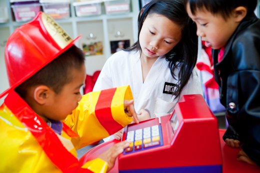 children playing in dramatic play area