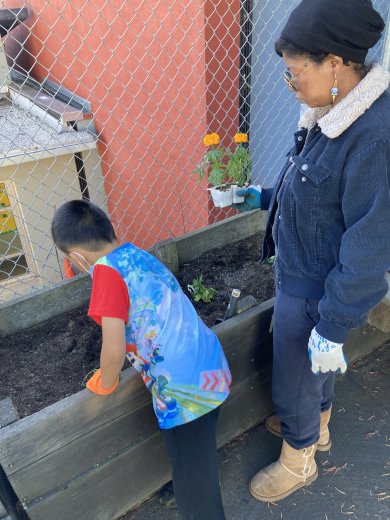 A mentor and student at the Jose Ortega Elementary School garden