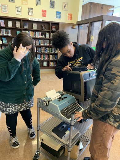 Students at Presidio Middle School help test equipment for an upcoming Vintage Tech Mini-Museum at the school library.