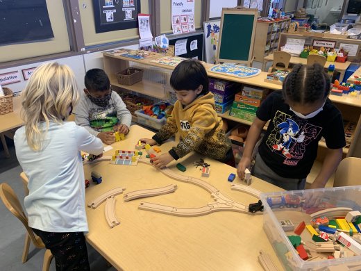children using trains at the table