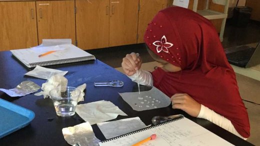 4th-grade student engaged in independent science experiment