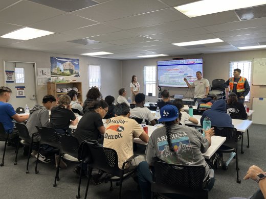 Students at a presentation by construction partners
