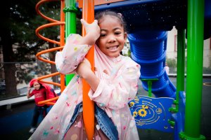 girl on play structure