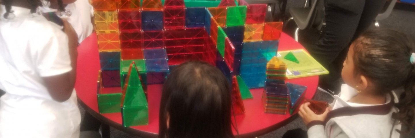 Students building with Magnatiles.