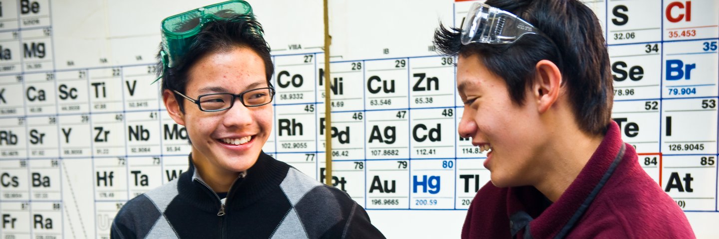 two high school students in science class