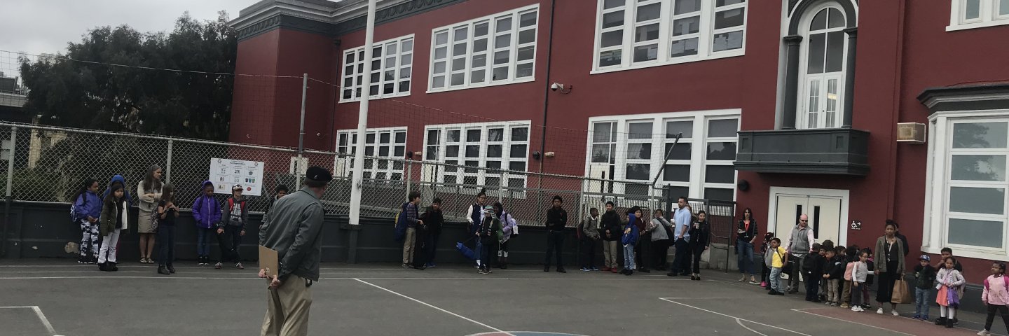 students and teachers on the school yard