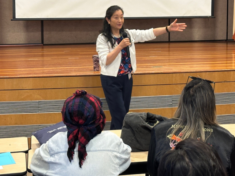 Dr. Maria Su speaking at a community town hall 