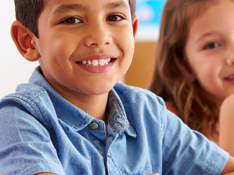 Four students smiling at camera 