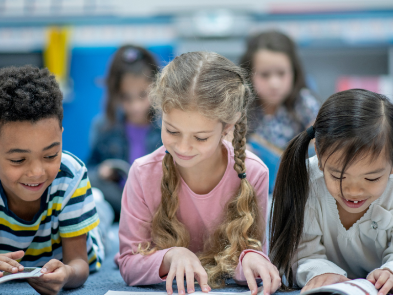 Three students reading. 