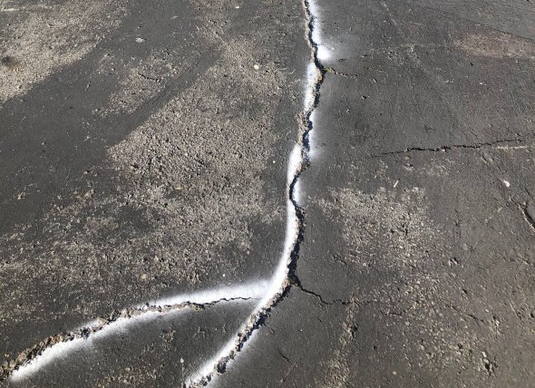 Cracks in the pavement on the Sanchez yard.