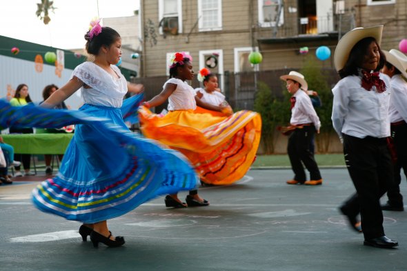 girls in blue skirt dancing