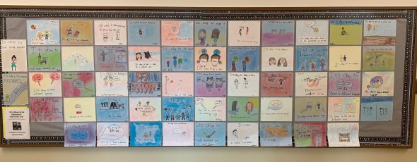inclusive schools bulletin board with pictures drawn by students