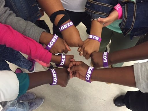 Students wearing LGBTQ pride wristbands