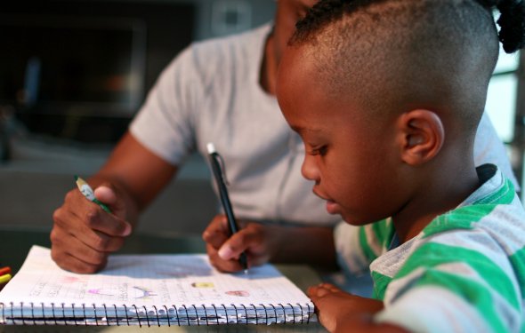 Boy and Father using notebook