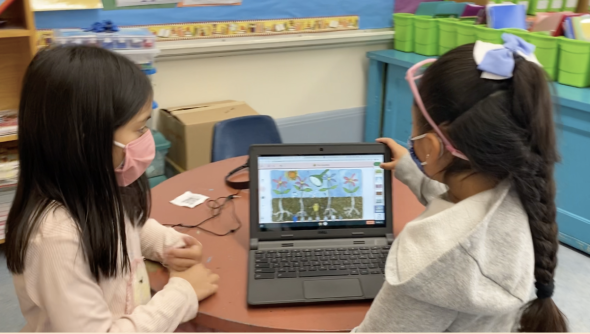 Young students using a Chromebook together