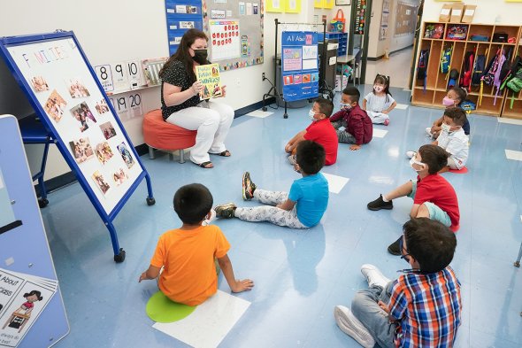 children listening to story at circle time
