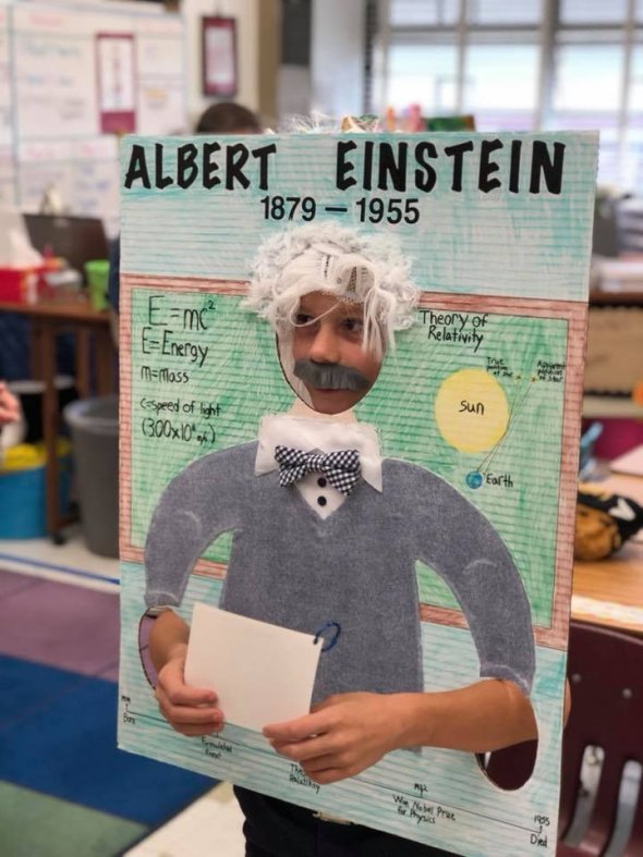 3rd grade student dressed as and giving a presentation on Albert Einstein
