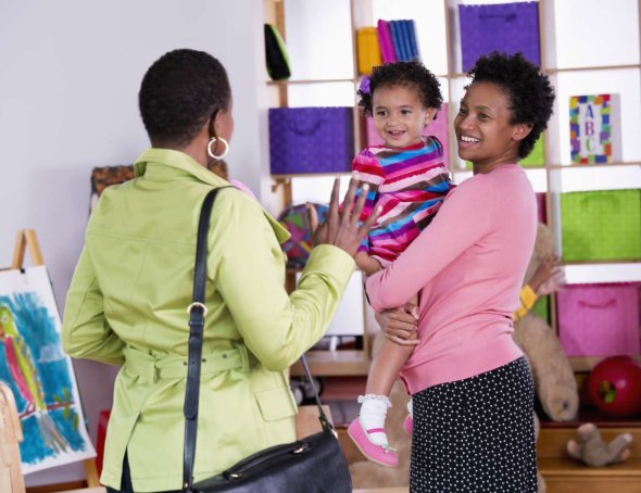 teacher greeting parent