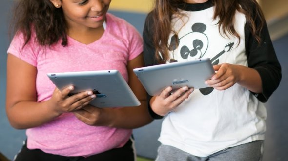 students on tablets