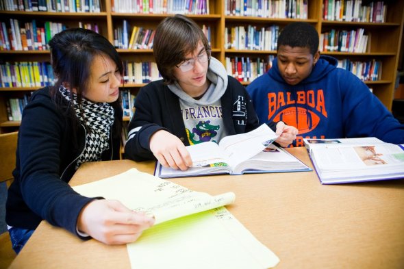 Students learning together in library