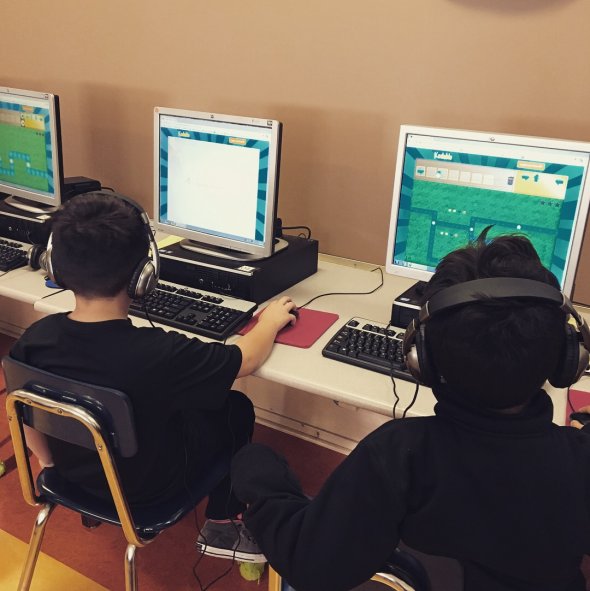 Students programming in technology integration class.