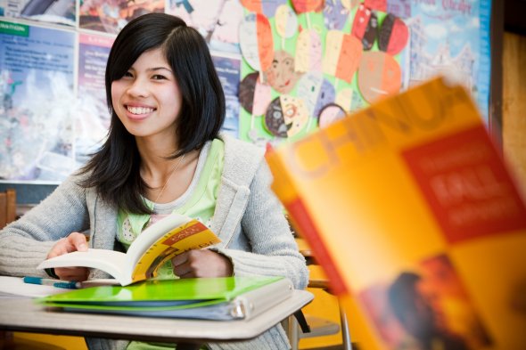 SFUSD approved stock photo, student reading book