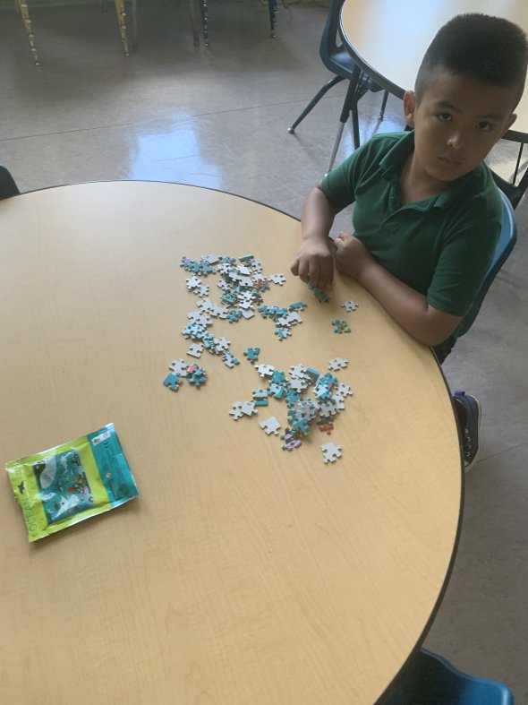 Student playing with a puzzle