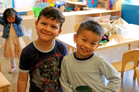 Two boys smiling at camera