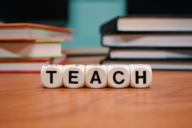 word "teach" spelled out with letters