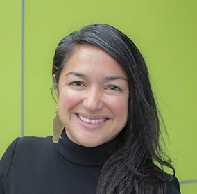 Smiling Latina woman with long hair