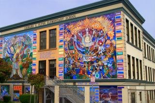 Picture of outside wall of Leonard R. Flynn Elementary School showing a colorful mural