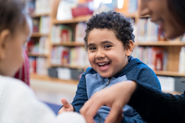 Boy smiling in library