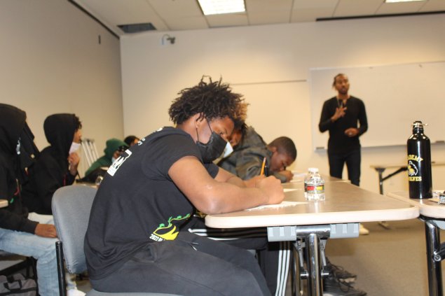 Students taking notes at a workshop