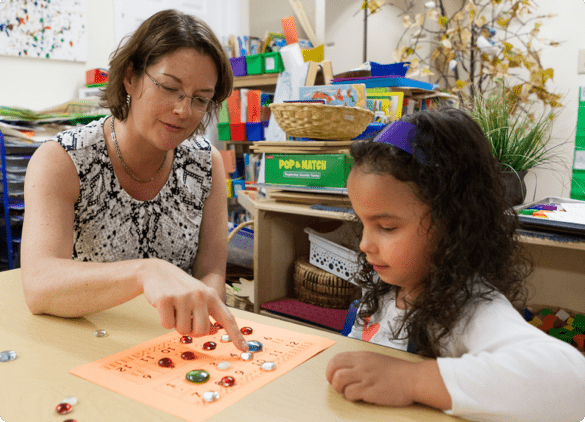 teacher doing math with a student