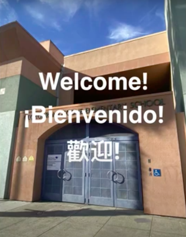 Moscone entrance with welcome text in English, Spanish and Cantonese