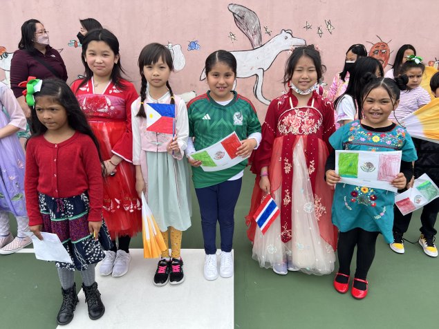 Students in colorful international costumes