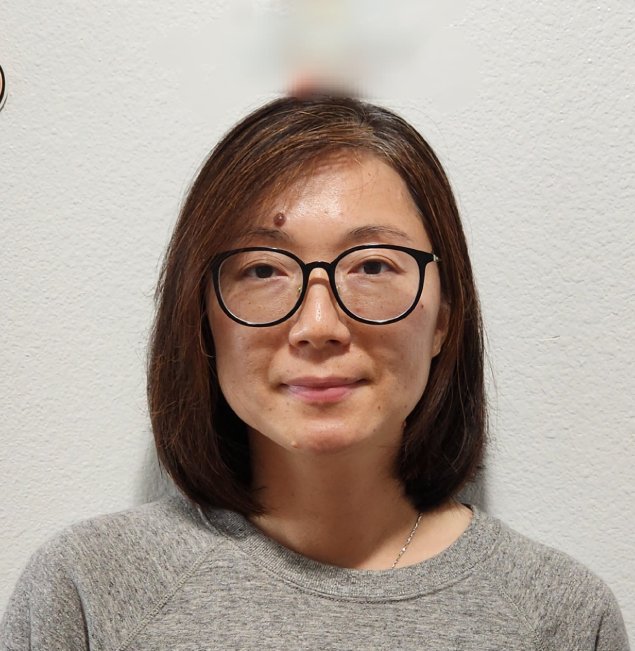 Smiling asian woman with brown hair