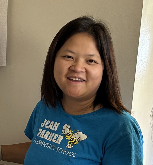 Smiling asian woman with long brown hair