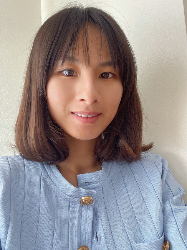 Smiling asian woman with brown hair